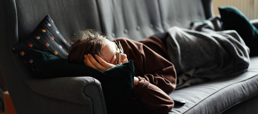 woman sleeping on couch