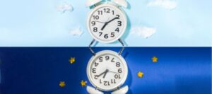 graphic of a split screen with alarm clocks on day and night backgrounds.