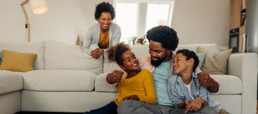 Family spending time together, smiling and laughing.