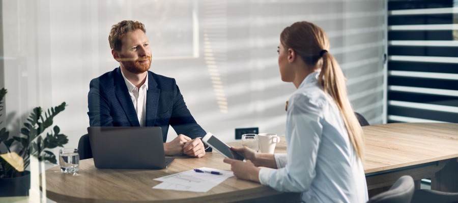 Man and woman in a meeting.